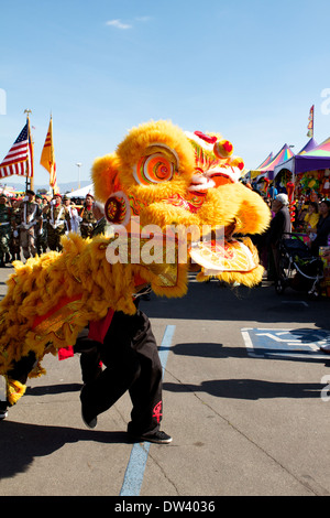 Traditional Vietnamese Lion dance performed at a Tet festival (lunar new year)  California supposedly to ward off evil spirits Stock Photo