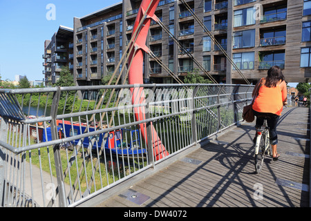 Cycling over the  Hertford Union Canal to Fish Island in Hackney Wick, in East London, UK Stock Photo