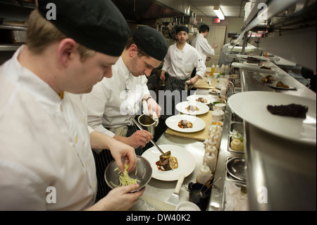 Chefs working in busy kitchen at Sanford's Restaurant in Milwaukee, Wi. Stock Photo