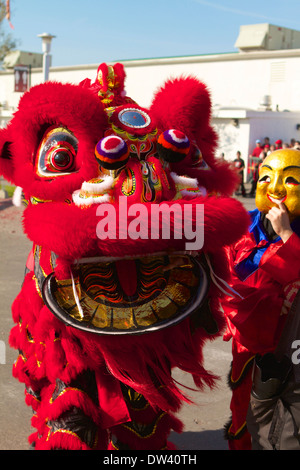 Traditional Vietnamese Lion dance performed at a Tet festival (lunar new year)  California supposedly to ward off evil spirits Stock Photo