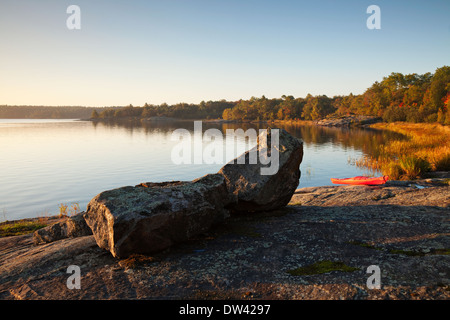 Interesting rock formations and a kayak along the Georgian Bay lakeshore in The Massasauga Provincial Park, Ontario, Canada. Stock Photo