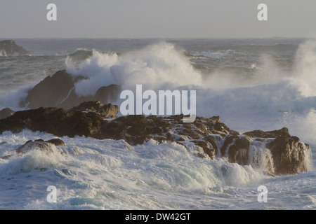 Waves crashing against rocks during stormy weather near Black Rock Resort, Ucluelet, Vancouver Island, BC, Canada in January Stock Photo