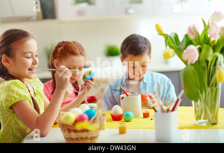 Preschoolers decorating Easter eggs Stock Photo