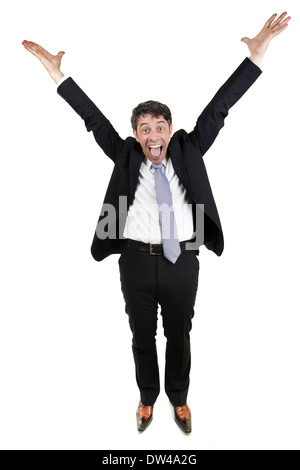 Jubilant businessman man cheering and raising his outstretched arms into the air in celebration, isolated on white Stock Photo