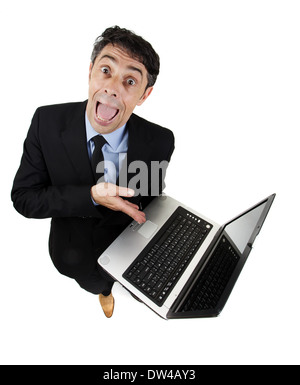 Persuasive garrulous businessman pointing to his computer with his hand as he explains and cajoles trying to win the argument Stock Photo