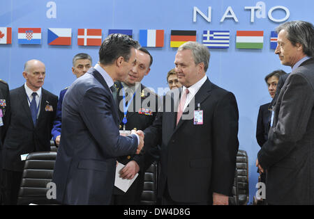 Brussels, Belgium. 27th Feb, 2014. NATO Secretary General Anders Fogh Rasmussen (L, front) shakes hands with Ukraine's First Deputy Defense Minister Oleksandr Oliynyk (2nd R, front) prior to the meeting of NATO-Ukraine Commission during the 2-day NATO Defence Ministers Meeting at its headquarters in Brussels, capital of Belgium, Feb. 27, 2014. Credit:  Ye Pingfan/Xinhua/Alamy Live News Stock Photo
