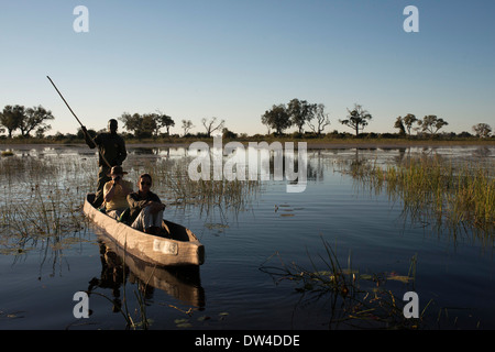 One of the ways to do is to do a water safari on a boat called mokoros , traditional canoes used by the inhabitants of the delta Stock Photo