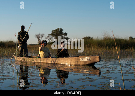 One of the ways to do is to do a water safari on a boat called mokoros , traditional canoes used by the inhabitants of the delta Stock Photo