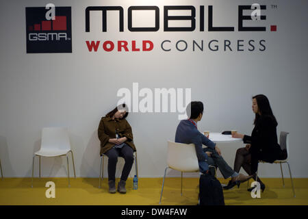 Barcelona, Spain. 27th Feb, 2014. MWC attendee resting at the fairgrounds hosting the convention.  Mobile World Congress held in Barcelona arrives at its last day after four journeys of intense activity  at the major event of mobile technology in the world. Credit:   Jordi Boixareu/Alamy Live News Stock Photo