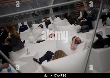 Barcelona, Spain. 27th Feb, 2014. MWC attendees resting at the fairgrounds hosting the convention.  Mobile World Congress held in Barcelona arrives at its last day after four journeys of intense activity  at the major event of mobile technology in the world. Credit:   Jordi Boixareu/Alamy Live News Stock Photo