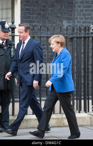 London, UK. 27th February 2014. 27th February, 2014. Downing Street, London, Uk. The German Chancellor Angela Merkel, is greeted by the British PM David Cameron at Downing Street after addressing both Houses of Parliament in London. Credit:  Lee Thomas/Alamy Live News Stock Photo