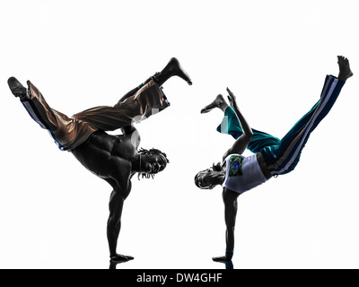 two people couple capoeira dancers dancing in silhouette studio isolated on white background Stock Photo