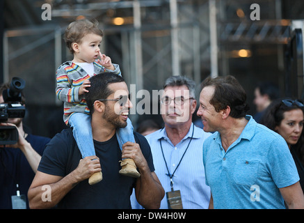 David Blaine, his daughter Dessa and Steve Guttenberg walk around the site of his latest challenge, 'Electrified' which features Blaine attached to a series of Tesla coils for 72 hours straight, without breaks for sleep or food held at Pier 54, Manhattan. Stock Photo