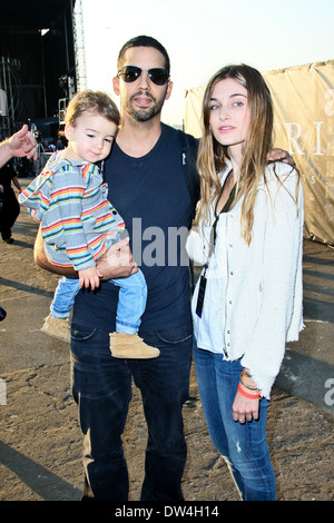 Alizee Guinochet, David Blaine and their daughter Dessa walk around the site of his latest challenge, 'Electrified' which features Blaine attached to a series of Tesla coils for 72 hours straight, without breaks for sleep or food held at Pier 54, Manhatta Stock Photo