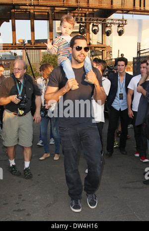 David Blaine and daughter Dessa walk around the site of his latest challenge, 'Electrified' which features Blaine attached to a series of Tesla coils for 72 hours straight, without breaks for sleep or food held at Pier 54, Manhattan. Featuring: David Blai Stock Photo