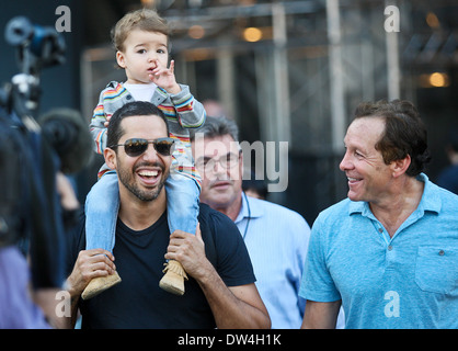 David Blaine, his daughter Dessa and Steve Guttenberg walk around the site of his latest challenge, 'Electrified' which features Blaine attached to a series of Tesla coils for 72 hours straight, without breaks for sleep or food held at Pier 54, Manhattan. Stock Photo