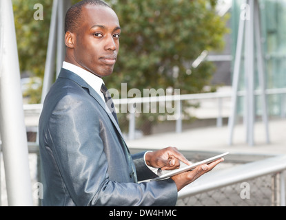 Portrait of a businessman using an electronic tablet Stock Photo