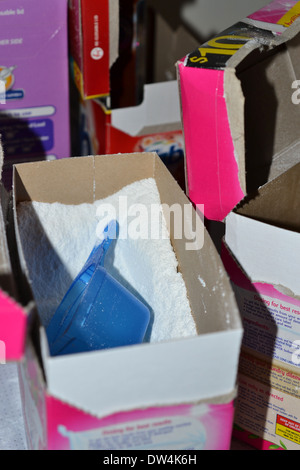 box of washing powder surrounded by empty ones Stock Photo