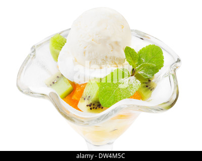 Ice cream in bowl with fruits and mint leaf, isolated Stock Photo