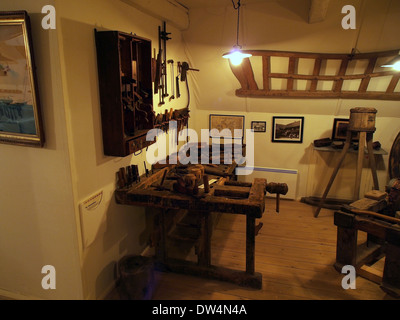 A carpenter workshop displaying various tools and materials used for woodworking. This setting showcases traditional craftsmanship and the techniques involved in creating wooden structures and furniture. Stock Photo