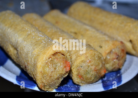Four Chiko rolls. The Chiko Roll is an Australian savoury snack, inspired by the Chinese egg roll and spring rolls Stock Photo