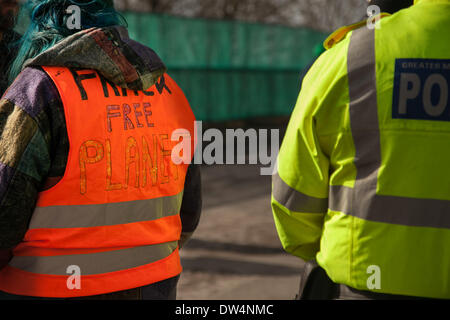 Manchester, Barton Moss, UK. 27th February, 2014.  Protester wearing 'Frack Free Plant' shirt as protests continue at IGAS Drilling Site.  Greater Manchester Policing operation at Barton Moss Drilling Site as protesters seek to delay and obstruct delivery vehicles and drilling equipment en-route to the controversial gas exploration site. Fracking protestors have set up a camp at Barton Moss Road, Eccles a potential methane-gas extraction site in Salford, Greater Manchester. Credit:  Mar Photographics/Alamy Live News. Stock Photo