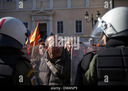 Protest in front Supreme Administrative Court of State in Athens. Teachers and Municipal Employees clash with riot police during protest against layoffs. Stock Photo