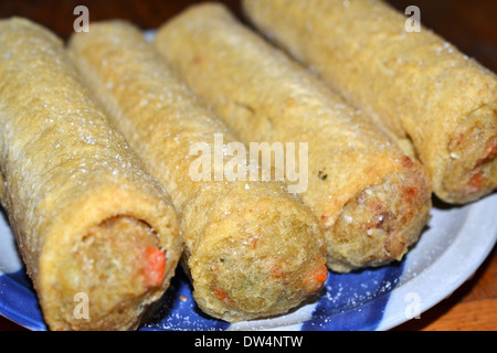 Four Chiko rolls. The Chiko Roll is an Australian savoury snack, inspired by the Chinese egg roll and spring rolls Stock Photo