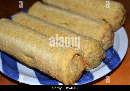 Four Chiko rolls. The Chiko Roll is an Australian savoury snack, inspired by the Chinese egg roll and spring rolls Stock Photo