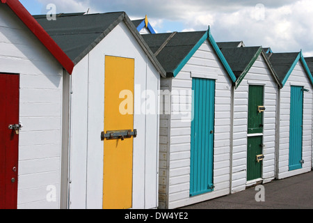 Brightly Coloured  Wooden Beach Huts on the Promenade at Paignton  in the Torbay area of Devon.England UK Stock Photo