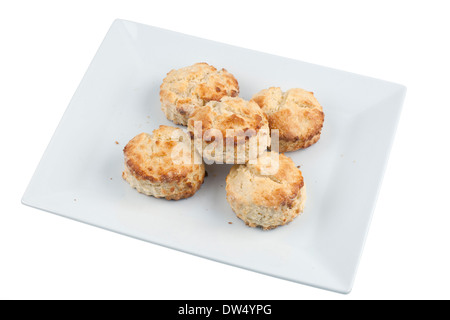 Five homemade plain scones on a white plate Stock Photo
