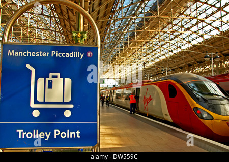 Passenger trains waiting in the station platforms at Manchester Piccadilly railway station Stock Photo