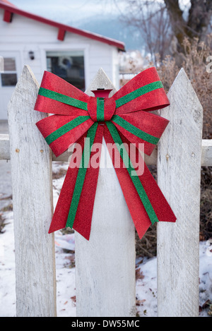 Festive bow on fence Stock Photo