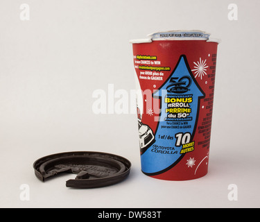 50th Anniversary Tim Horton's roll up the rim to win contest coffee cup with lid on white background Stock Photo