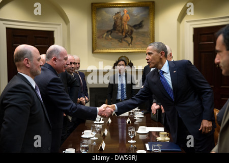 President Barack Obama greets Speaker Osama al-Nujaifi, Iraqi Council of Representatives, after he drops by Vice President Joe Biden's meeting with the Speaker in the Roosevelt Room of the White House, Jan. 22, 2014. Stock Photo