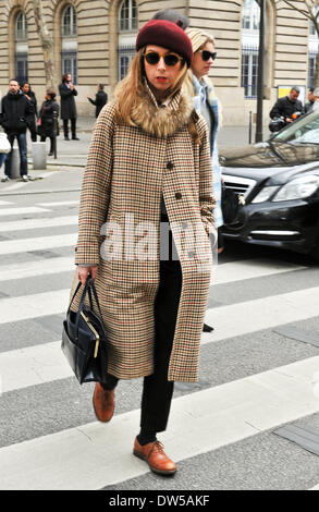 A chic showgoer attending the Dries Van Noten runway show during Paris Fashion Week in Paris - Feb 26, 2014 - Runway Manhattan/Celine Gaille Stock Photo