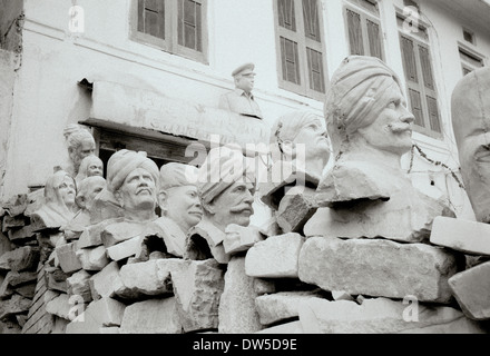 Travel Photography - Street scene of stonemason heads in Jaipur in Rajasthan in India in South Asia. Art Stone Bizarre Reportage Documentary Stock Photo