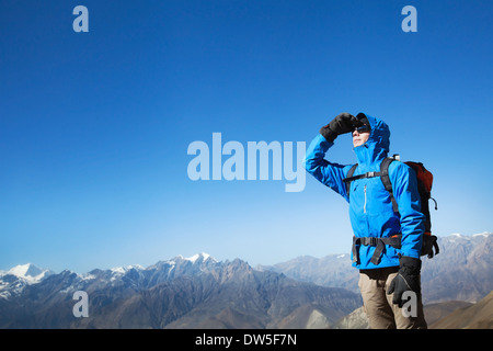 backpacker in the mountains Stock Photo