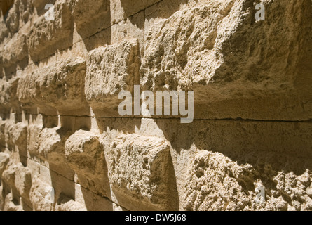 Old weathered brick wall in diminishing perspective Stock Photo
