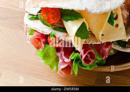 oriental bread with smoked meat and greens. Stock Photo