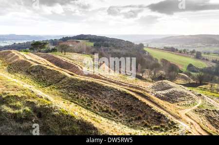 View south of Cotswold escarpment edge over Severn Vale: ancient hill fort, Painswick Beacon, Gloucestershire, on a stormy day Stock Photo