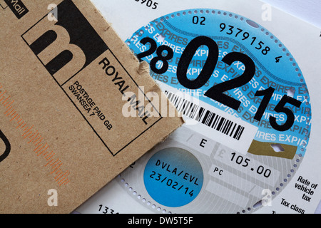 tax disc expires 280215 - replacement car tax disc received in post from DVLA as a result of renewing online Stock Photo