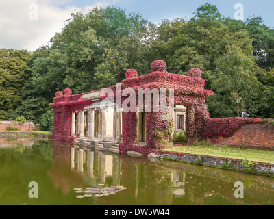 Virginia Creeper in full colour covering ancient columns and arches at Didlington Manor Norfolk England Stock Photo