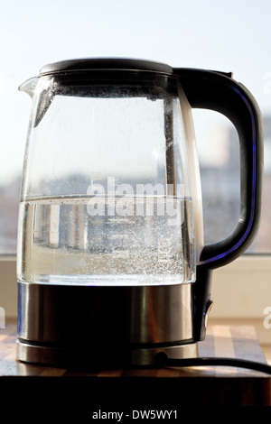 electric kettle with boiling water in home kitchen Stock Photo