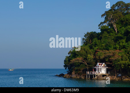 Shrine and fishing boat, Ao Yai Bay, Koh Kood, Thailand. Stock Photo