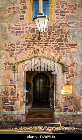 Entrance to the ancient Luttrell Arms Hotel on the main street of Dunster Exmoor Somerset UK Stock Photo