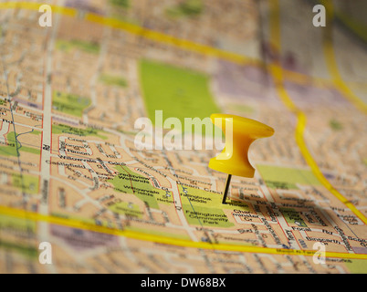 Yellow pushpin on a map