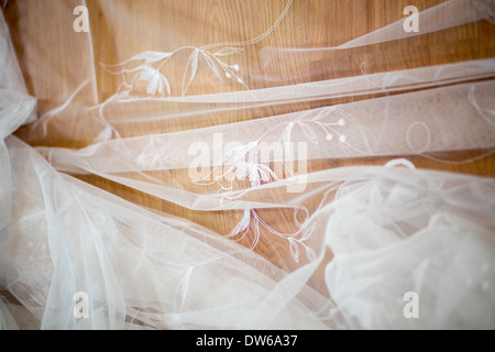 Working from home, beautiful drapes and the remarkable curtains tailor at work. Stock Photo