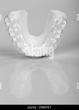 Translucent upper essix retainer on a plaster study model placed on a ...