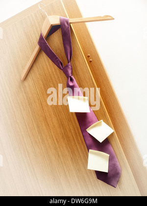 Few sticky notes on a tie as a symbol of planning in business. Stock Photo